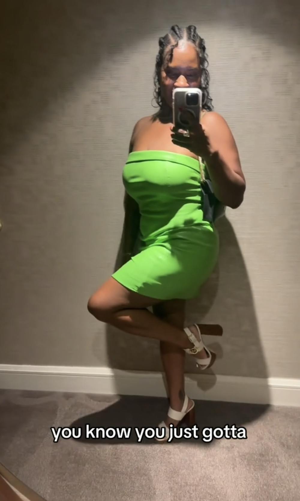 Green dress and wedges girl showing off her clubbing outfit: an apple-green halter mini dress and white wedge heels. Text overlay reads 'you know you just gotta'