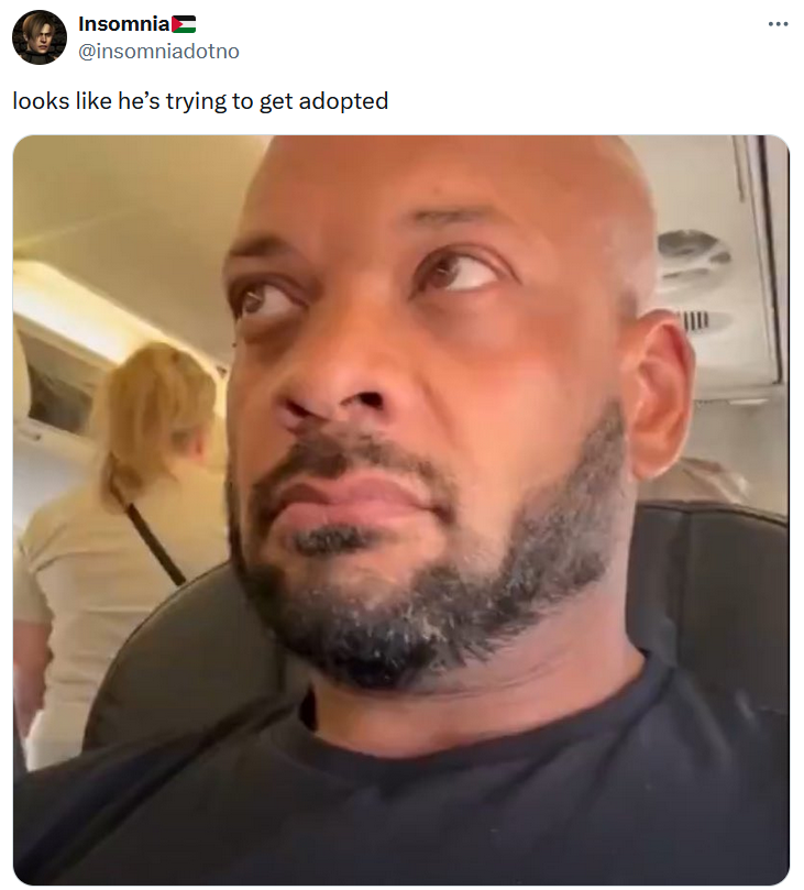 Guy in plane wearing convicted felon shirt meme about getting adopted.