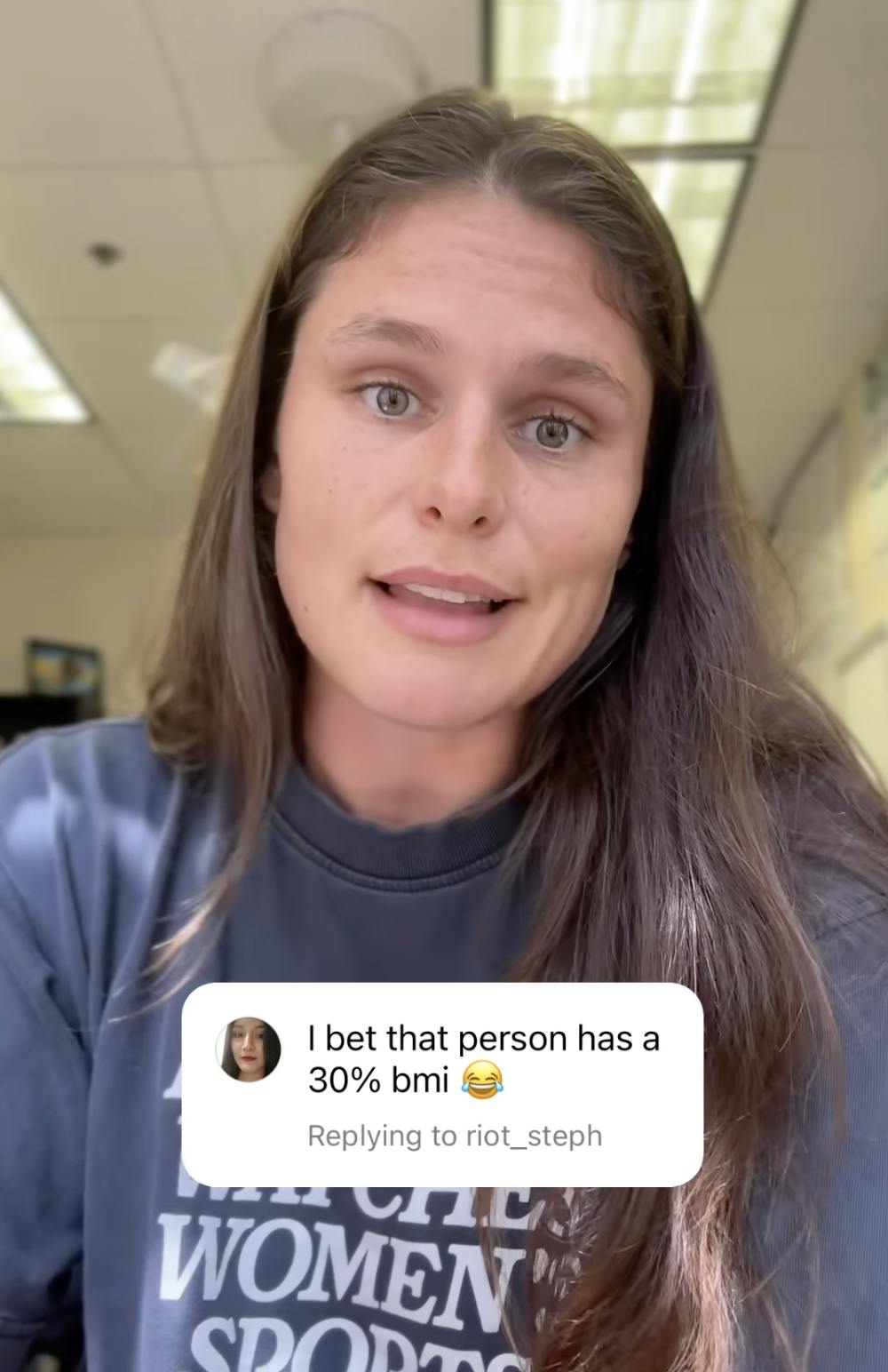 Olympic athlete Ilona Maher looking disappointed at the camera. A comment she's replying to says, 'I bet that person has a 30% bmi (crying laughing emoji)'