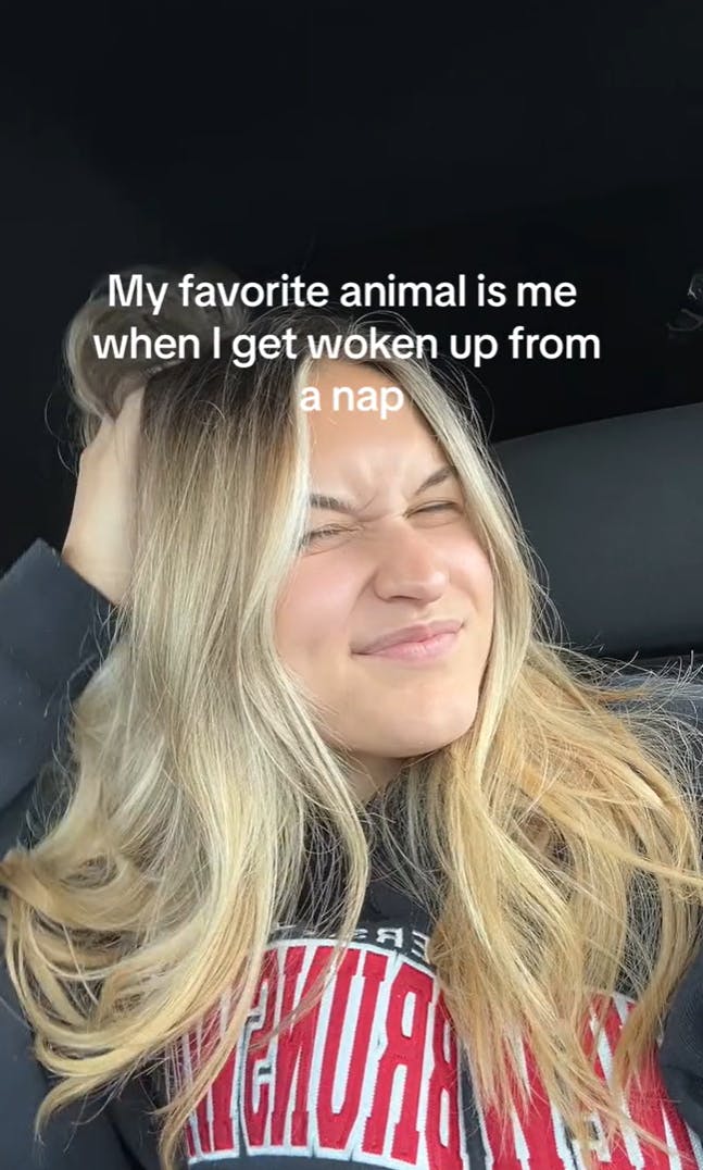 A blonde woman scratching her head and grimacing. Text overlay reads, 'My favorite animal is me when I get woken up from a nap'