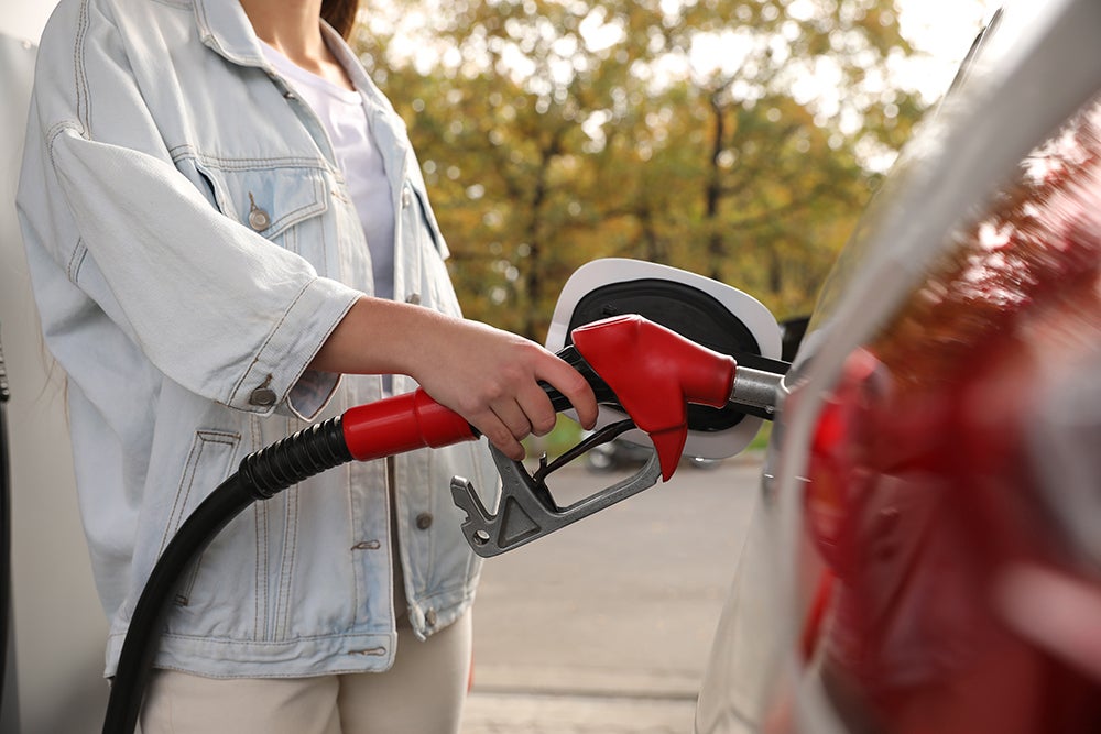 Someone pumping gas into their car