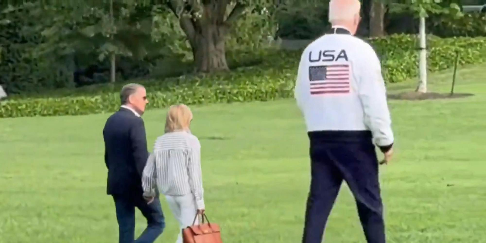 the Biden family walking on a lawn