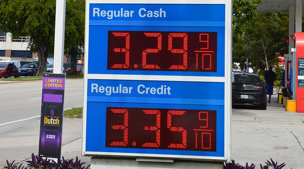 Fort Lauderdale, Florida, USA - November 16, 2021: Mobil Food Mart gas station sign with cash and credit price of regular gas on the corner of N. Federal Highway and NE 6th Street in Fort Lauderdale.