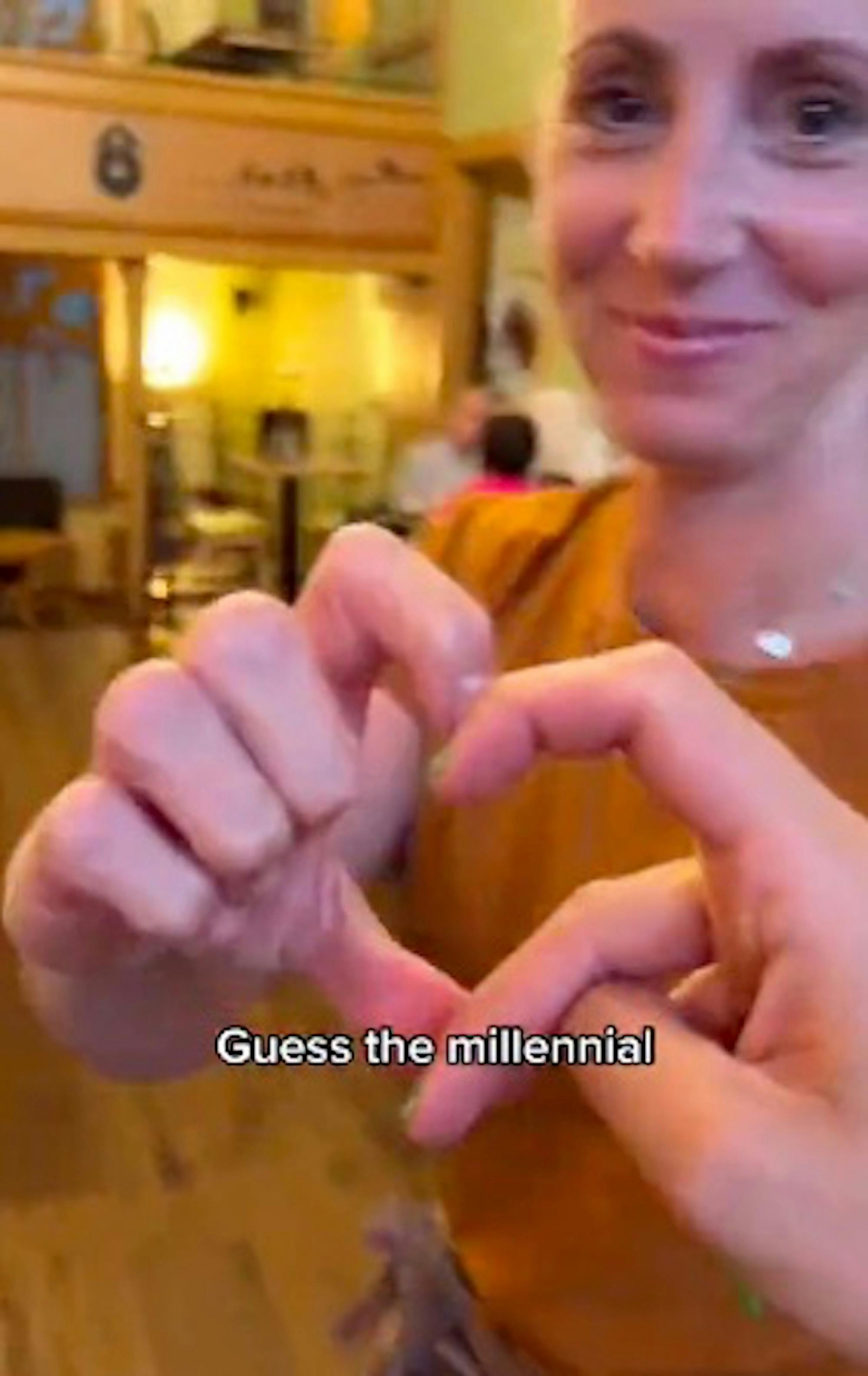 Screenshot from TikTok by user @zoii.tsa captioned, “Gen Z vs. millennial' showing heart hands shapes