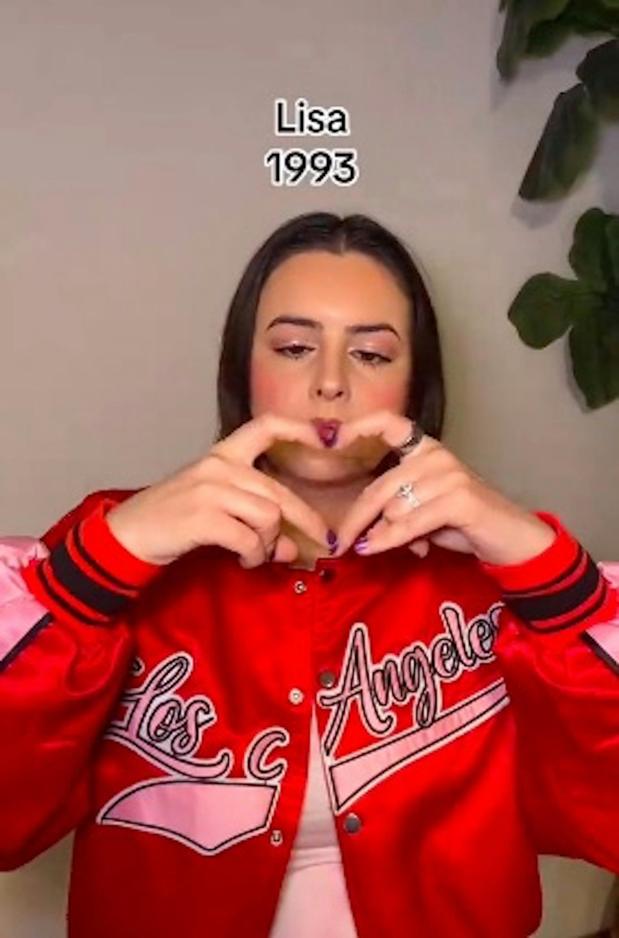 Screenshot from TikTok by @cimorelliband where millennials try to do gen z heart hands