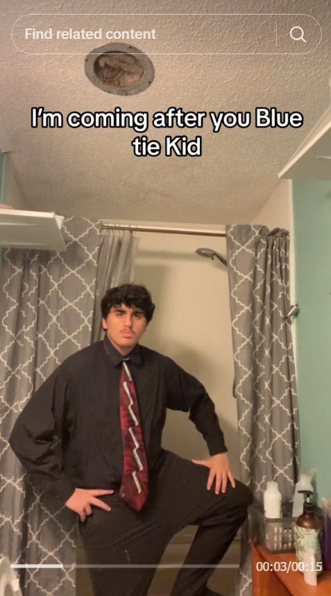 kid challenges blue tie kid