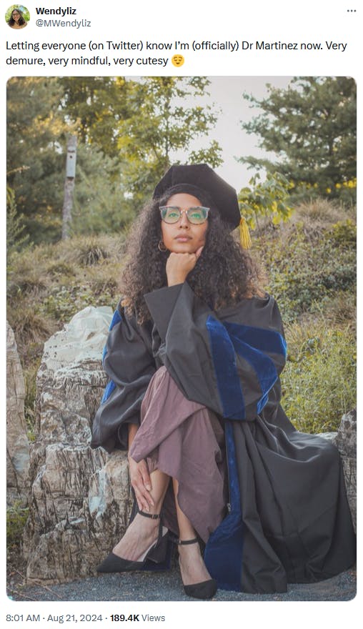 Demure meme with a photo of a woman in a graduation gown and cap.