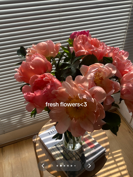 Dopamine menu TikTok video showing a bouquet of pink flowers.