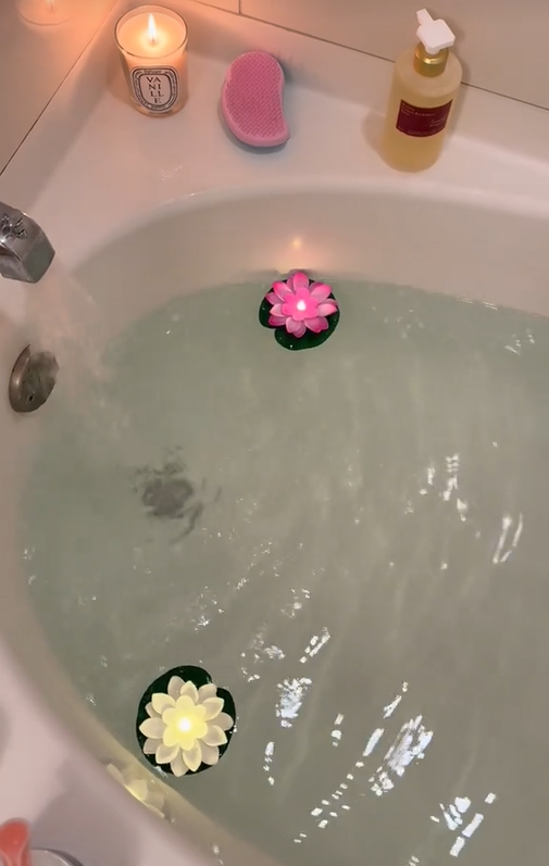 Dopamine menu TikTok video showing a bath with floating candles.