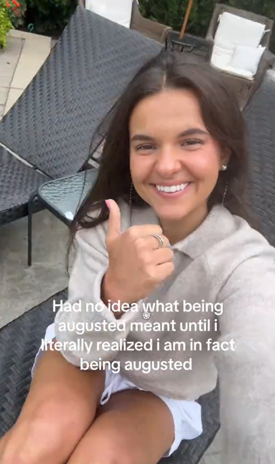 Young woman giving the camera a thumbs up and smiling. Text overlay reads, 'Had no idea what being augusted meant until I literally realized i am in fact being augusted.'