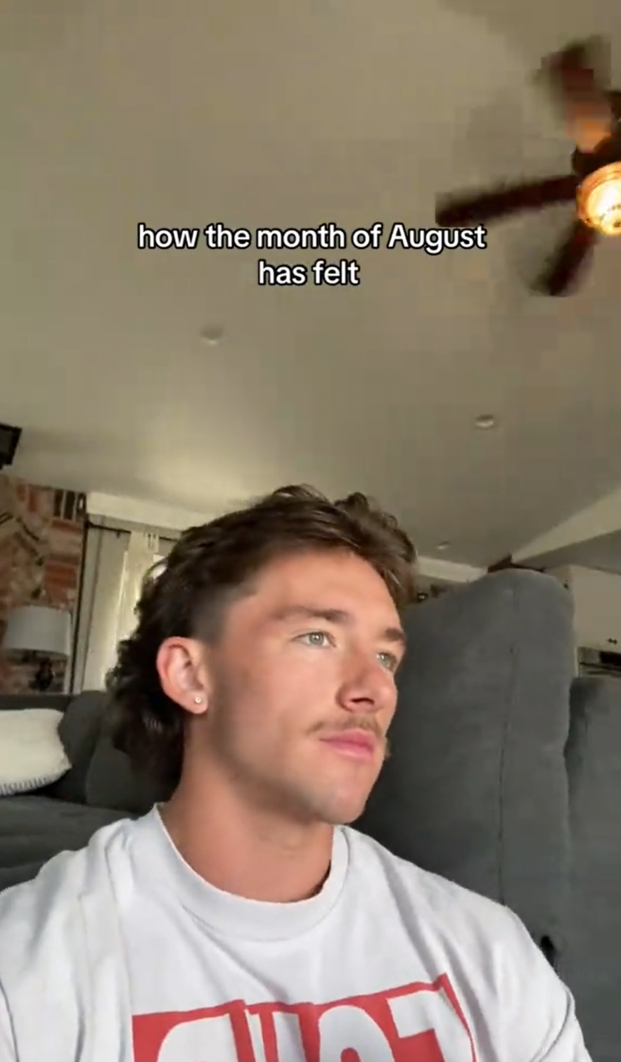 A man with a moustache staring off into the distance. Text overlay reads, 'how the month of August has felt.'