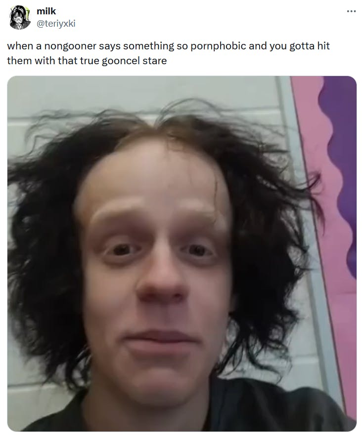 Gooning meme with a man with messy hair staring into the camera.