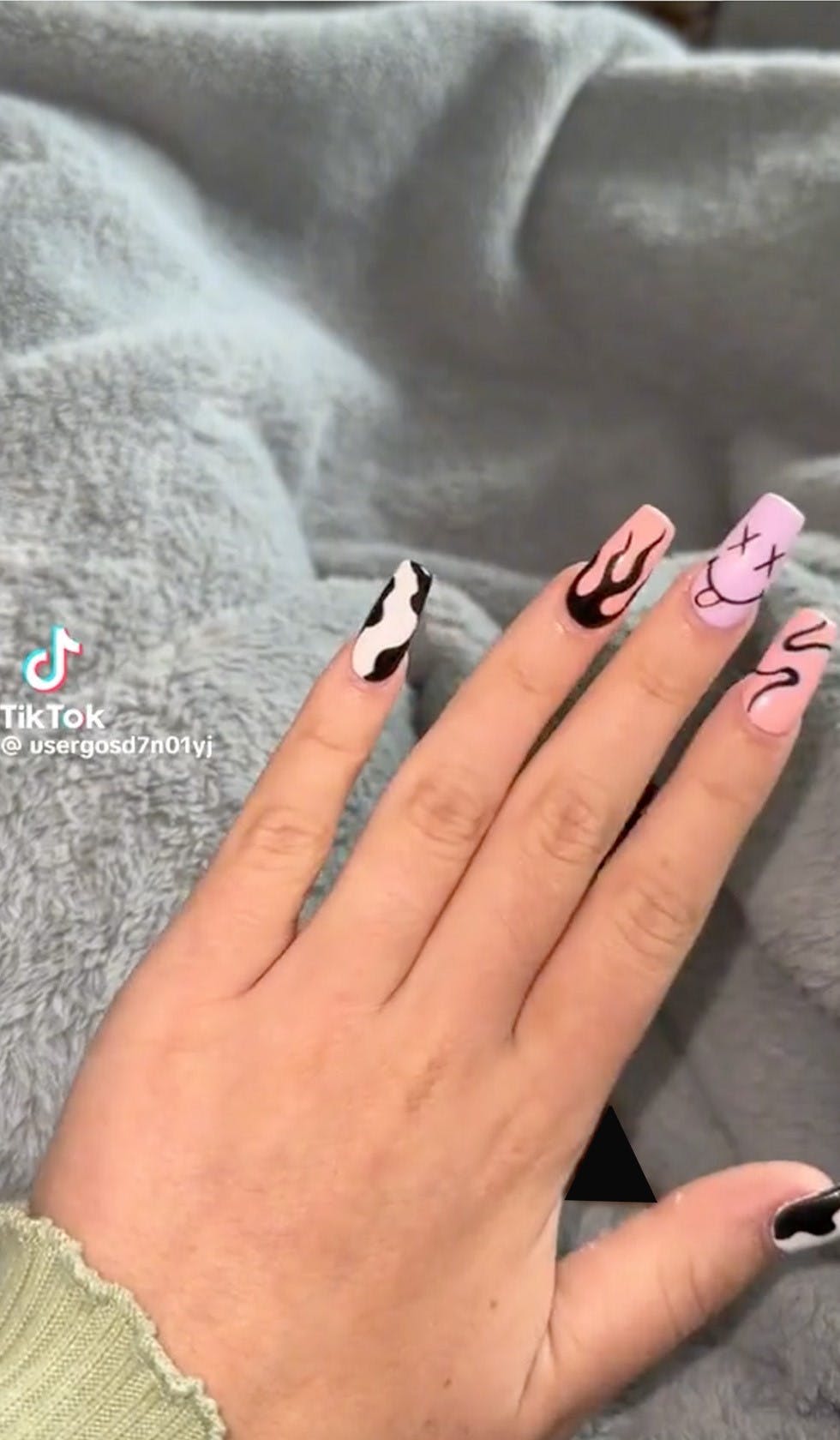 TikTok screenshot of a woman showing off her new manicure.