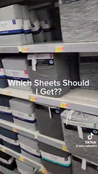 Screenshot of bed sheet shelves at a Walmart. Text overlay reads, 'Which Sheets Should I Get??'