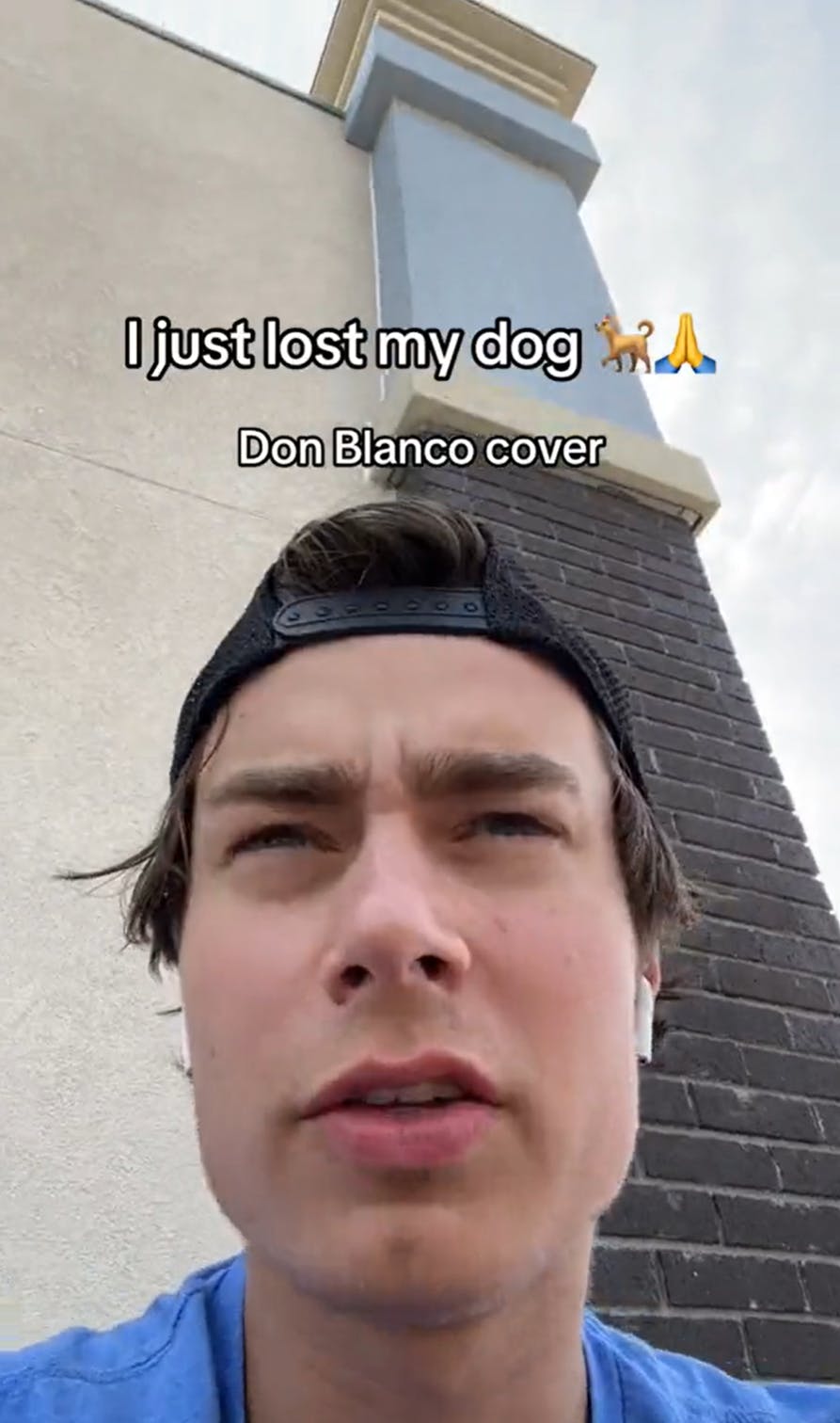 Close up view of a man in a backwards cap sitting next to a building. Text overlay reads, 'I just lots my dog. Don Blanco cover.'