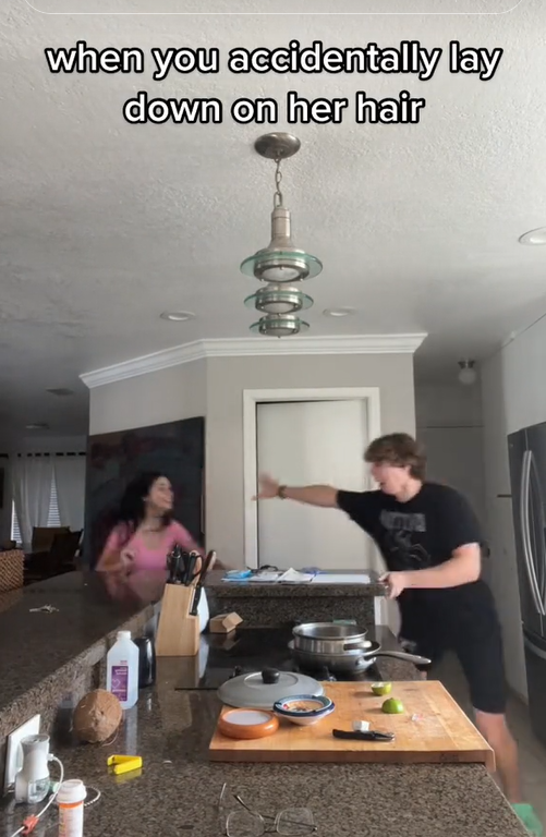 Let me tell you something meme with a woman chasing a man around a kitchen island.