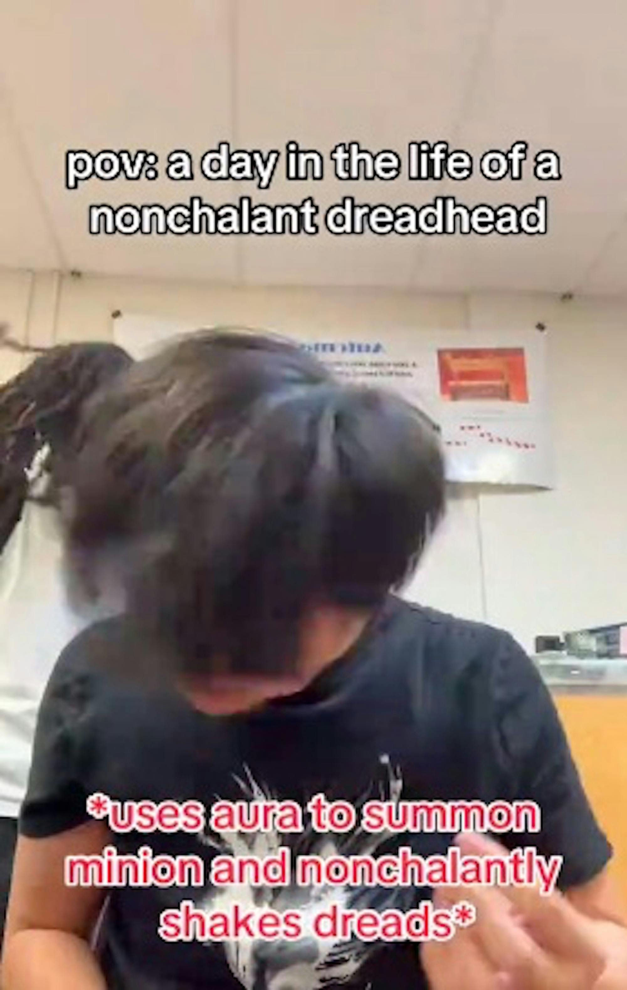 Nonchalant dreadhead character on TikTok wuth friend in background