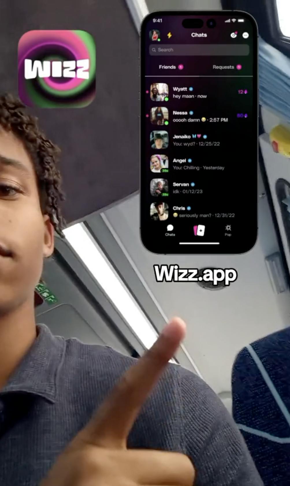 Young man pointing at an overlaid image of the Wizz app on his screen.