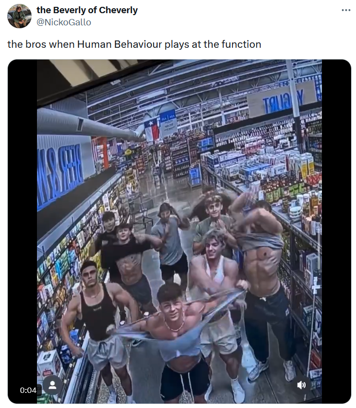 Bjork Frat meme with a video of young men taking their shirts off for a store security camera.