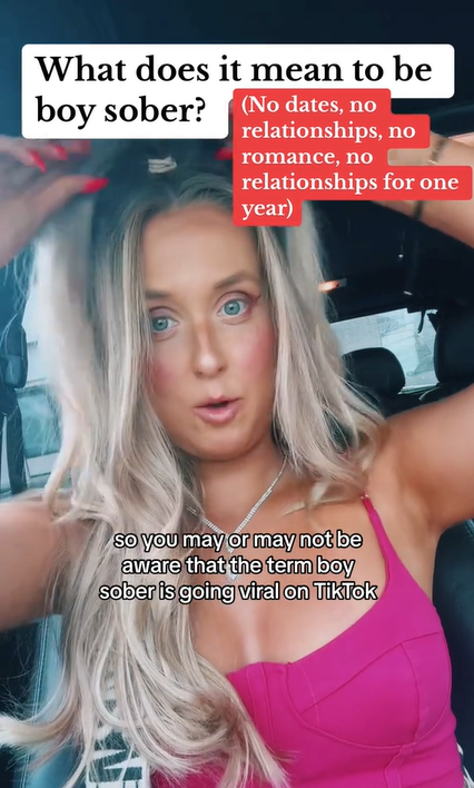 A blonde woman sitting in her car. Text overlay reads, 'What does it mean to be boy sober? (No dates, no relationships, no romance, no relationships for one year)' and the caption reads, 'so you may or may not be aware that the term boy sober is going viral on TikTok.'