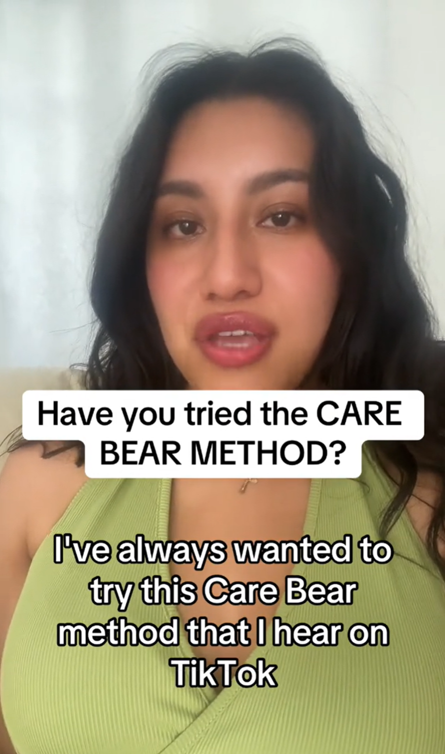 A black-haired woman looking into the camera. Text overlay reads, 'Have you tried the CARE BEAR METHOD? I've always wanted to try this Care Bear method that I hear on TikTok.'