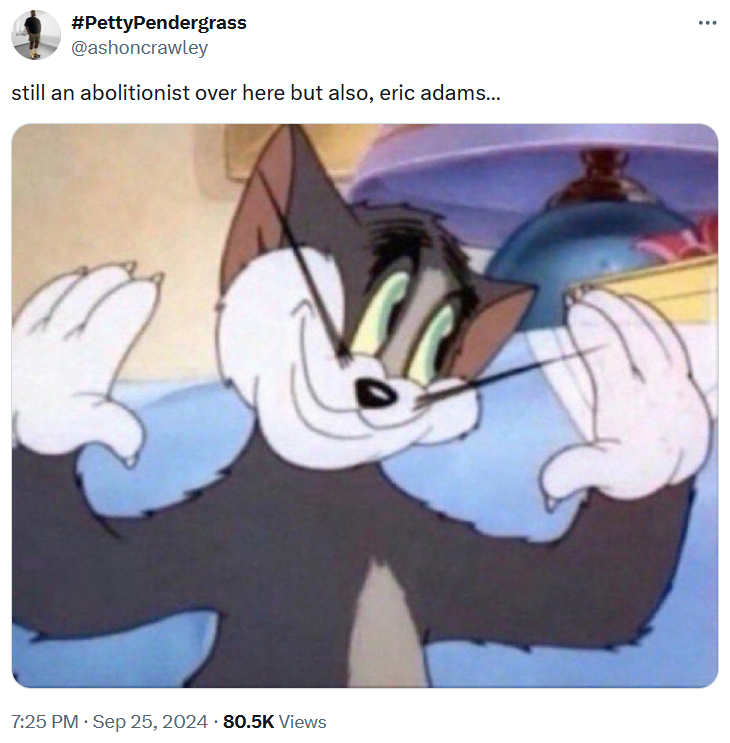 Eric Adams indictment meme with an image of Tom from Tom & Jerry holding up his hands and smiling.