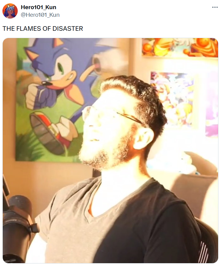 The Flames of Disaster meme with a photo of a man looking into a bright sunbeam.