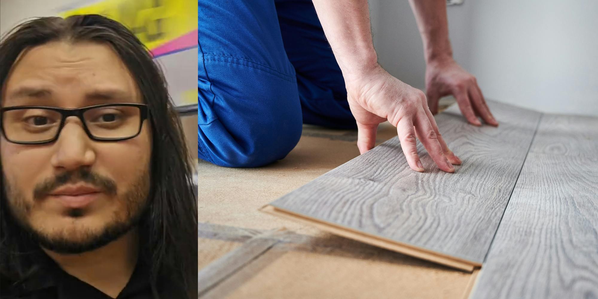 A person looking at the camera next to a person installing wood flooring.