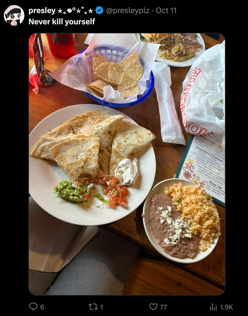 A X post depicting a tabletop of a Mexican restaurant. On the table is lots of food- a quesadilla, chips, drink, rice and beans and a menu. The post is captioned 'Never Kill Yourself.'