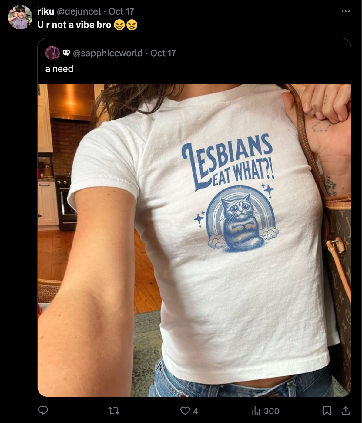 An X post subtweeting a woman taking a selfie wearing a shirt that says 'Lesbians Eat What? and a scared kitten.' The post is captioned 'U R Not A Vibe Bro'