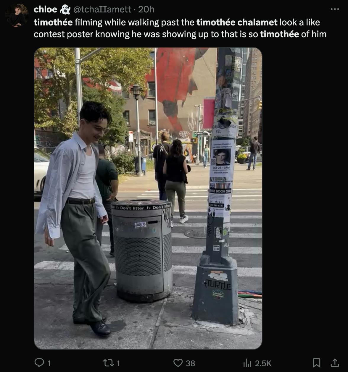 An X post sharing a photo of Timothee Chalamet walking past a pole that advertises a Timothee Chalament look-alike contest.