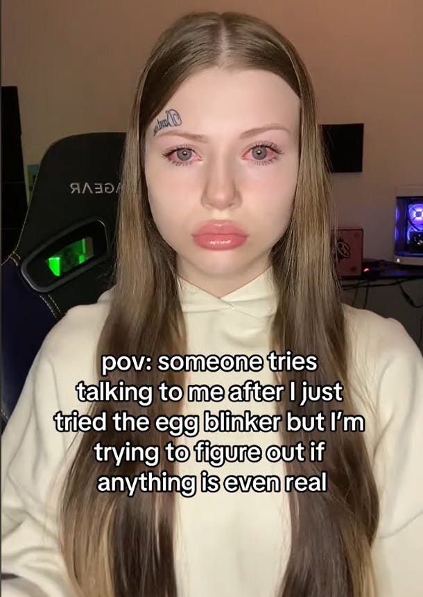 Egg blinker meme showing a woman with very red eyes and a blank stare.