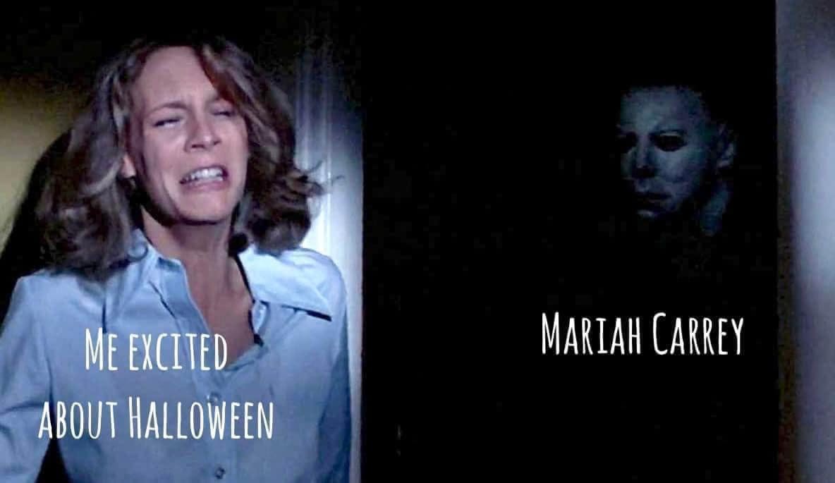 Halloween meme with a woman cowering behind a door from a killer. Text on top of her says 'me excited about Halloween' and over him says, 'Mariah Carrey.'