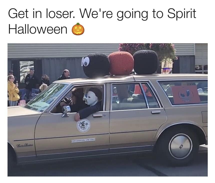 Halloween meme of Michael Myers in a car covered in decorations. Text reads, 'Get in loser. We're going to Spirit Halloween.'