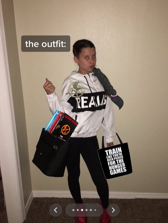 Stan Twitter Meme Girl in Hunger Games merchandise.