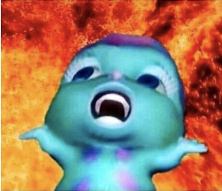 A modified 'Bibble' meme (green and blue creature) shouting to the heavens while fire engulfs him