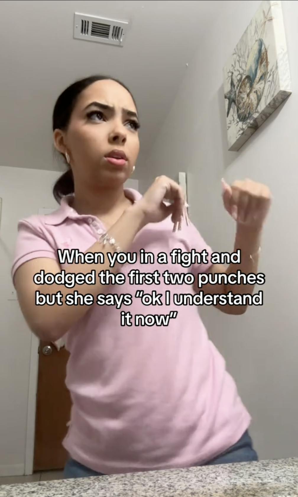 A woman with long nails faux-boxing. Text overlay reads, 'When you in a fight and dodged the first two punches but she says 'ok I understand it now''