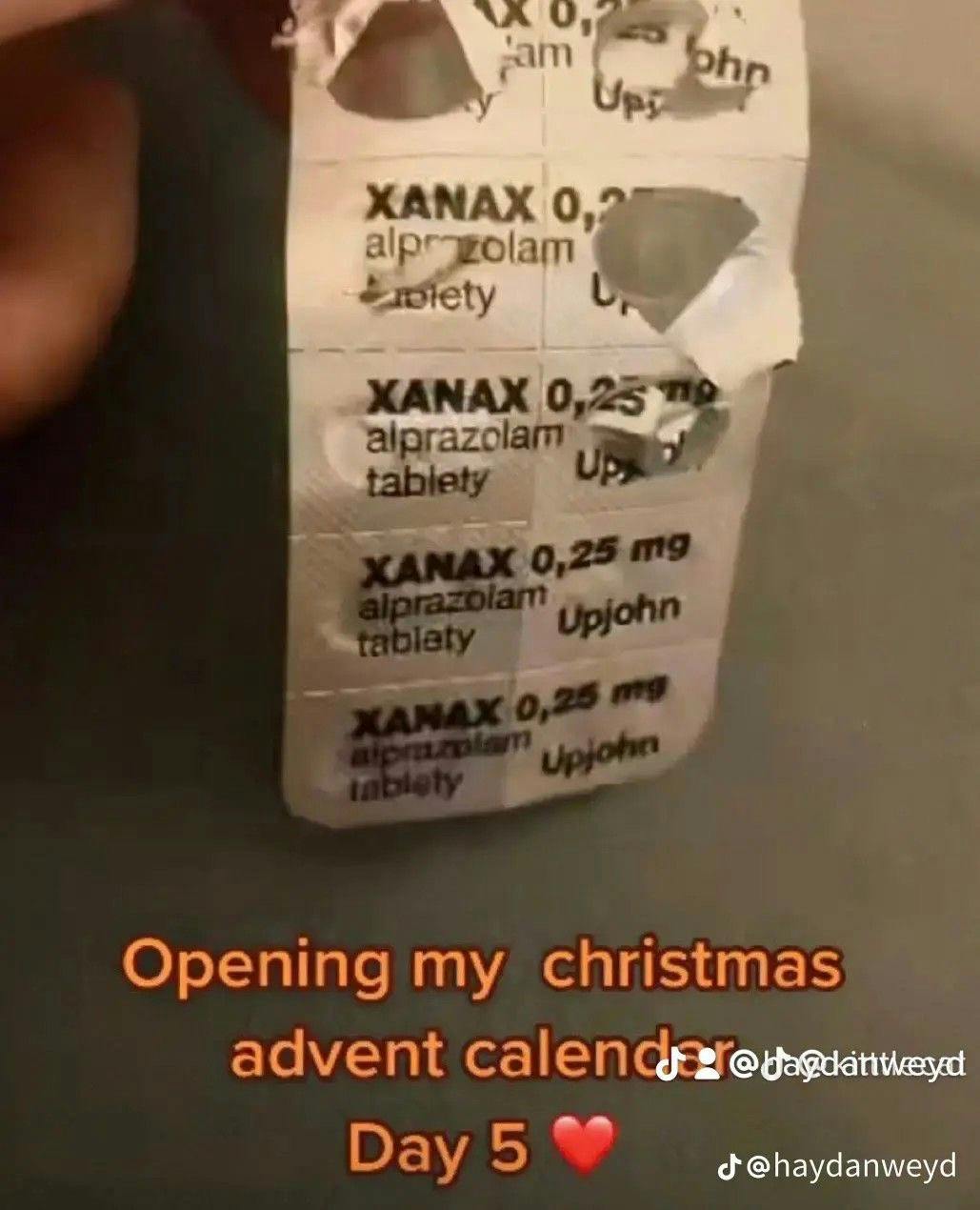 Christmas meme with a photo of a pill pack of Xanax. Text reads, 'Opening my christmas advent calendar Day 5 (heart emoji)'