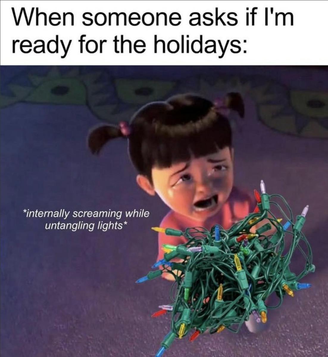 'When someone asks if I'm ready for the holidays:' Boo from Monsters Inc sobbing over tangled Christmas lights with the text '*internally screaming while untangling lights*'