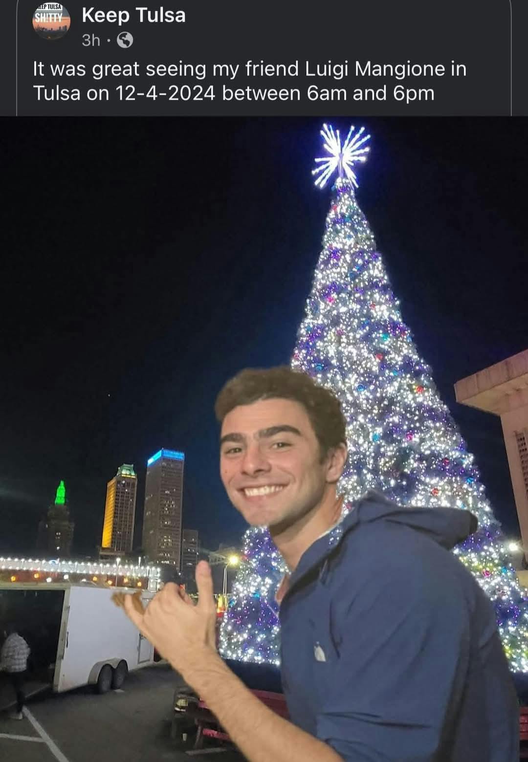 Luigi Mangione Alibi meme with him in front of a lit city Christmas tree in Tulsa.