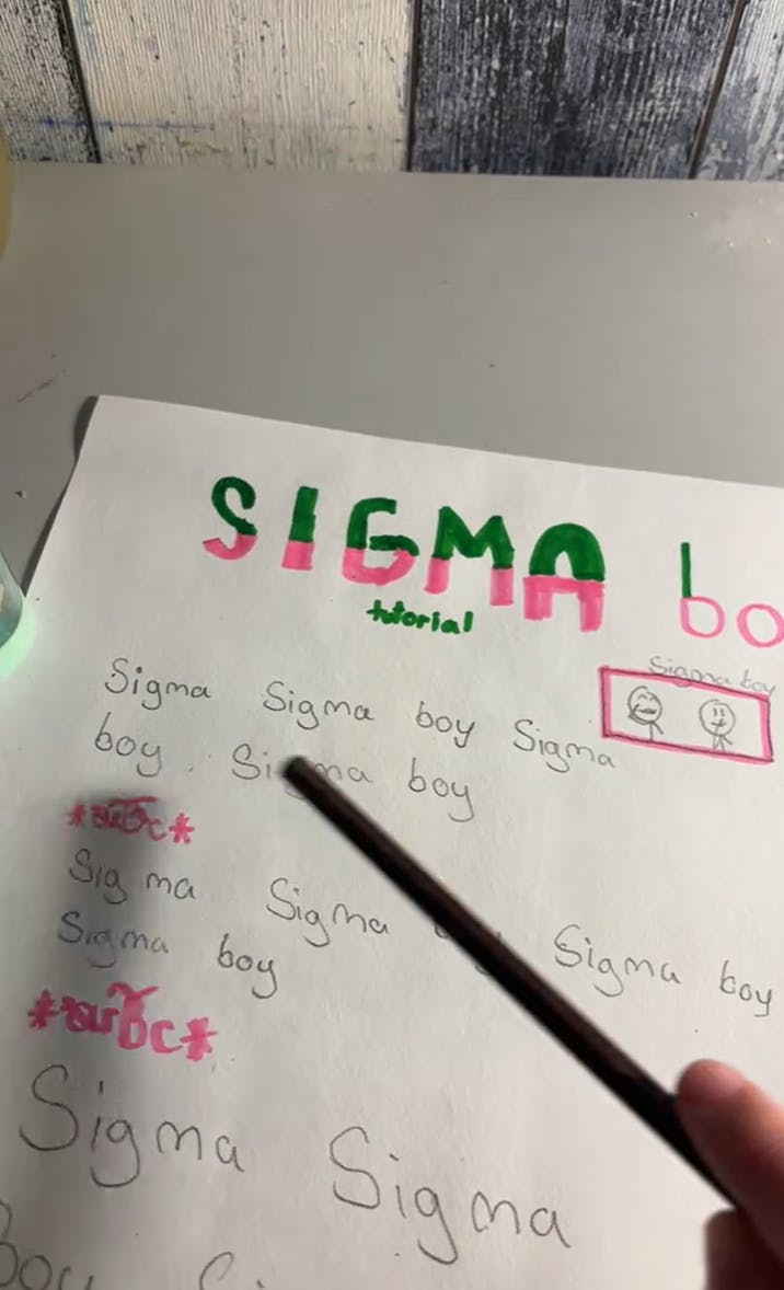 TikTok where someone has written out the lyrics to the viral Sigma Sigma Boy song and is pointing at the words as the song plays.