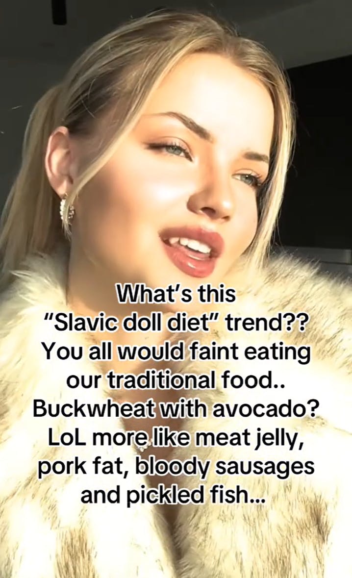 TikTok of a blonde Slavic woman in a fur staring off into the distance. Text overlay reads, 'What's this 'Slavic doll diet' trend?? YOu all would faint eating our traditional food.. Buckwheat with avocado? LoL more like meat jelly, pork fat, bloody sausages and pickled fish...'