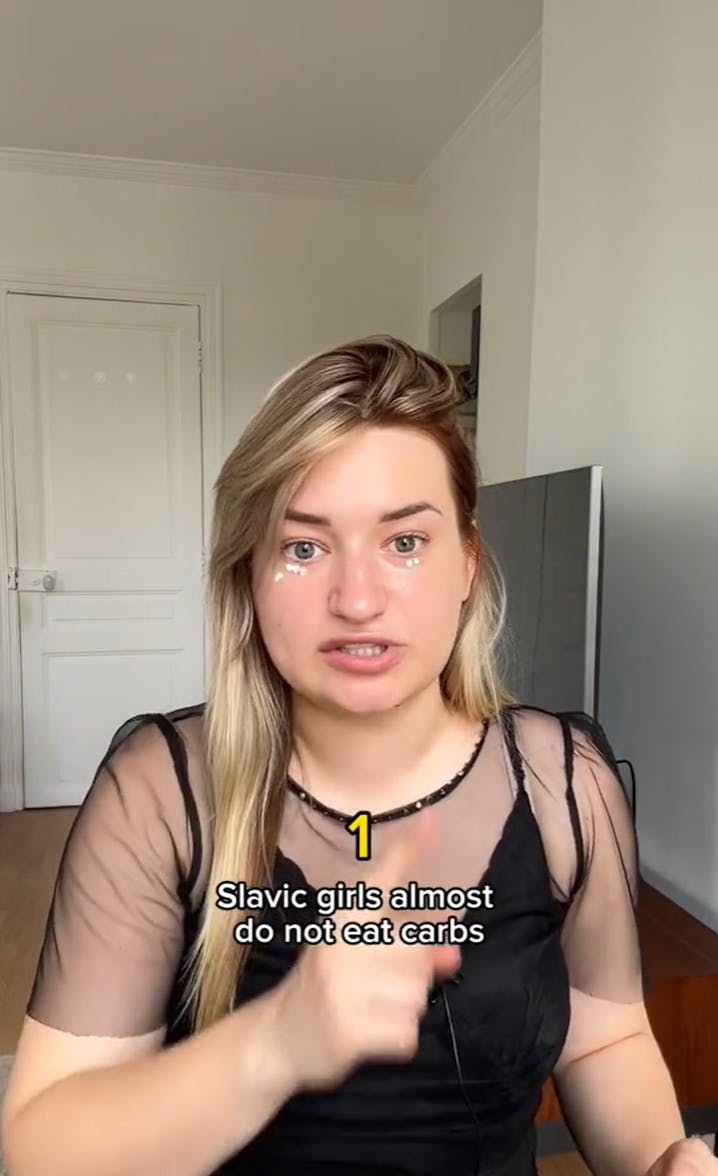 A Slavic woman putting on makeup and explaining what a Slavic woman's diet actually is, rather than the Slavic doll TikTok diet.