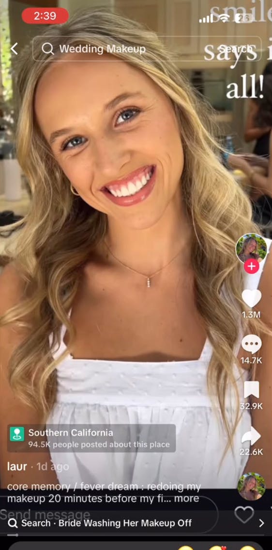 Bride smiling for the camera after her her professional makeup appointment.