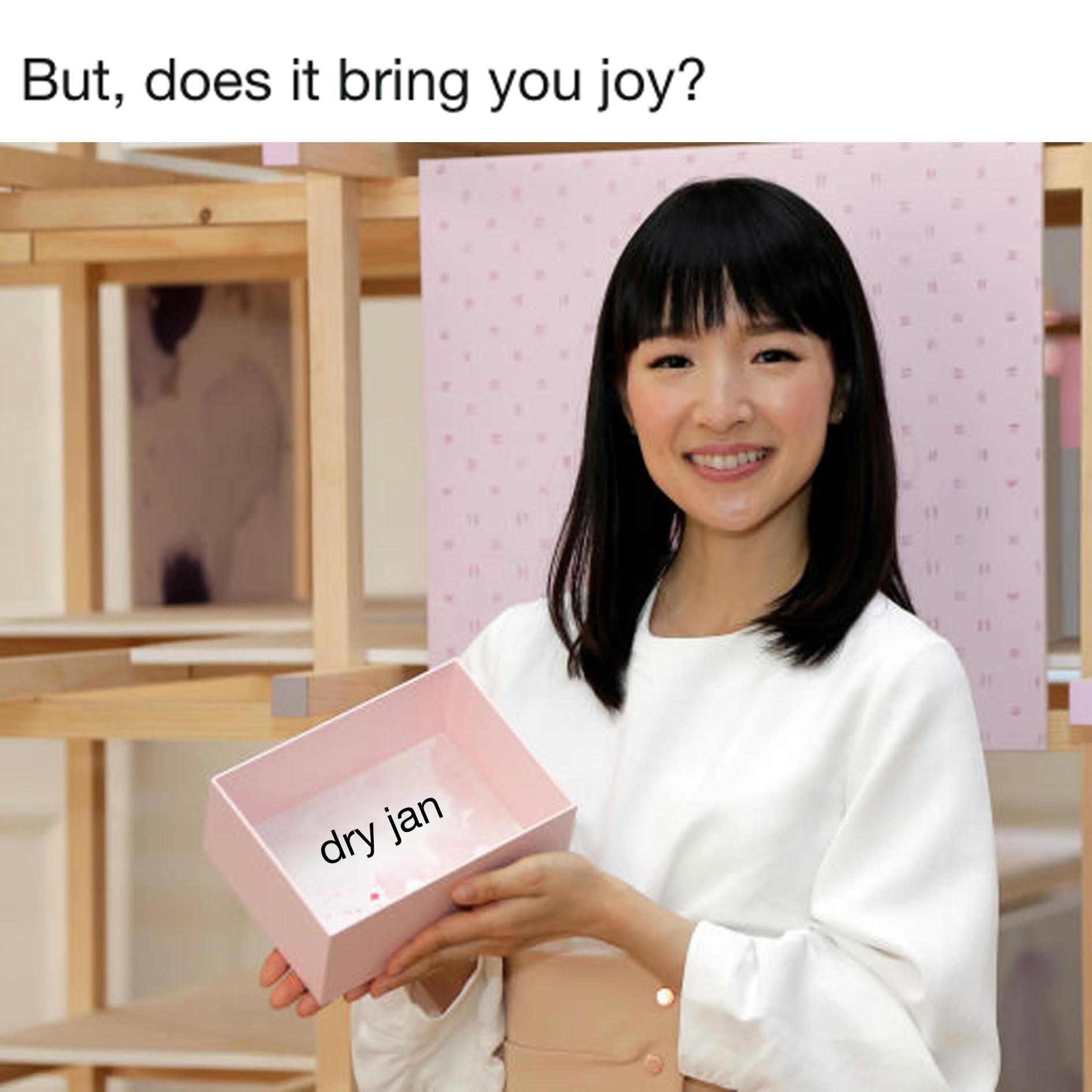 Marie Kondo meme. Text reads, 'But, does it bring you joy?' and she is holding a pink box with the text, 'dry jan' inside.