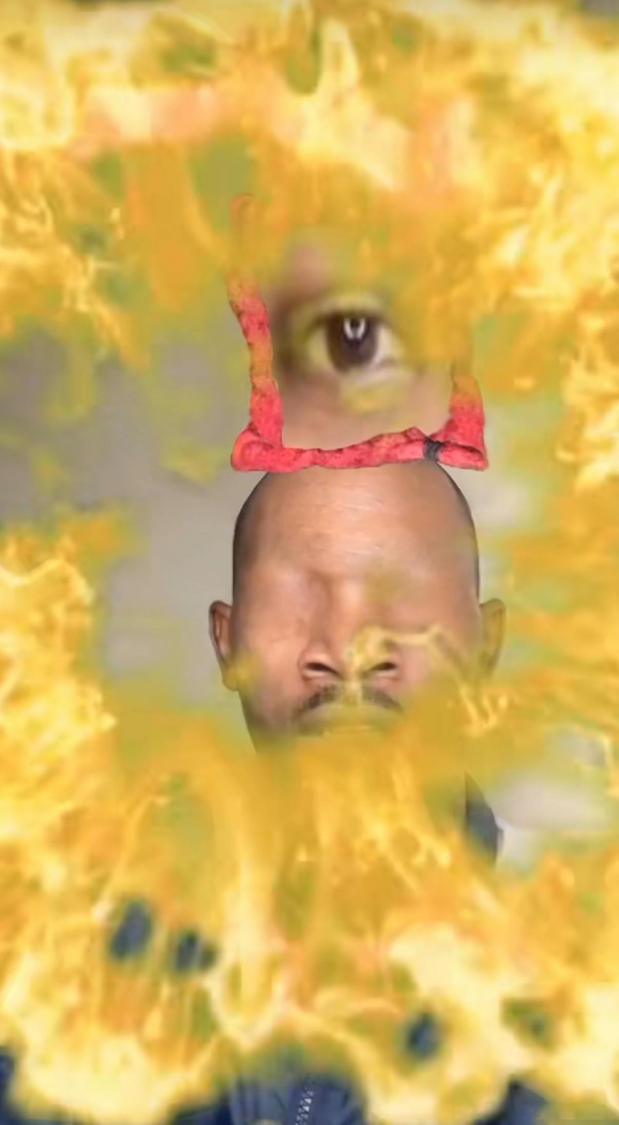 Eye of Rah meme edit with a Black man, his eye floating above his head with fire all around him.