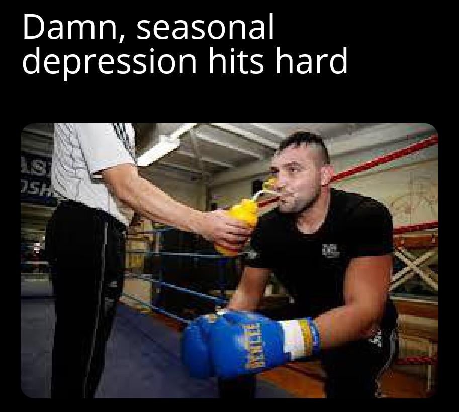 January meme, text reads, 'Da**, seasonal depression hits hard' with a photo of a boxer in the ring drinking some water.