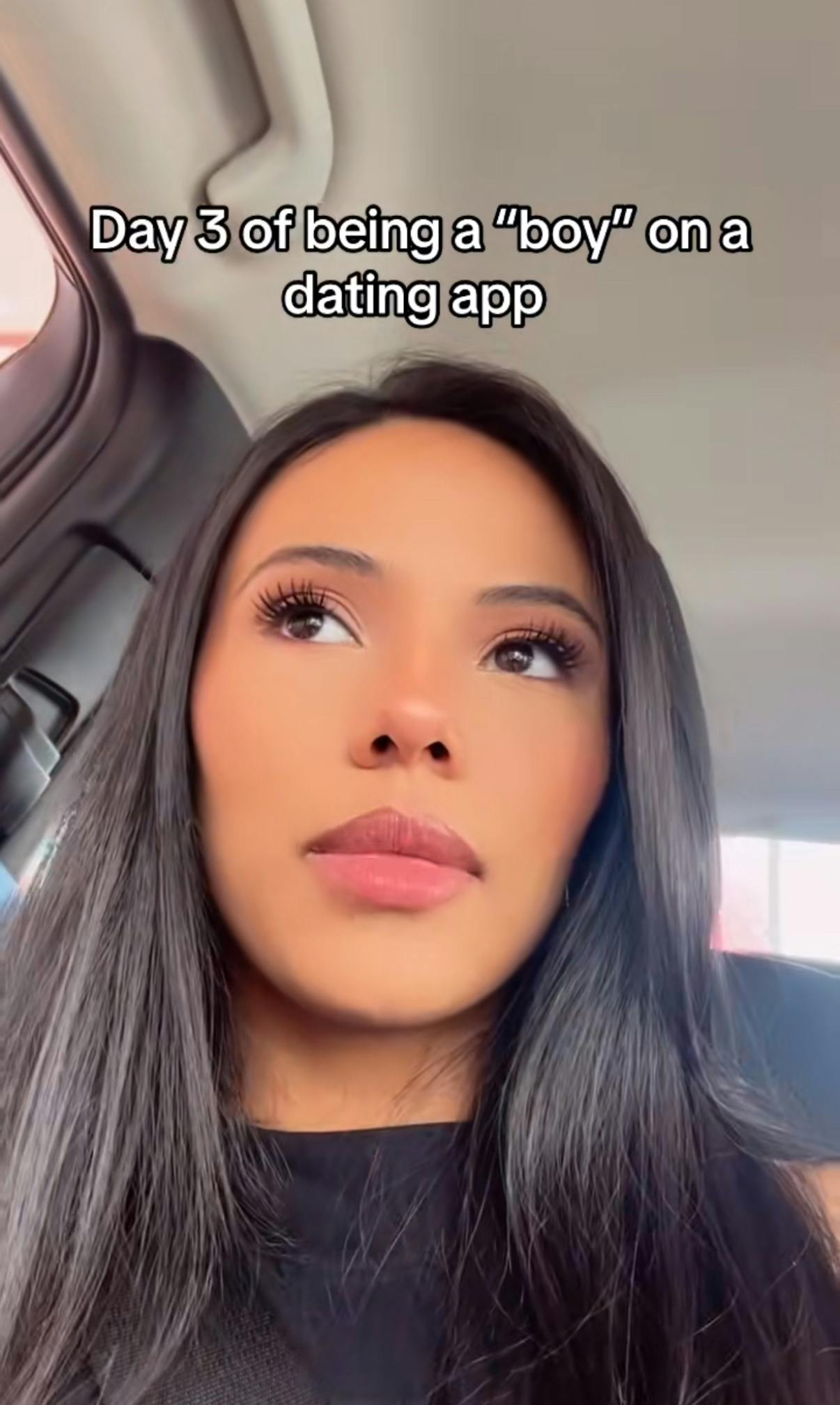 TikTok video of a woman sitting in her car. Text overlay reads, 'Day 3 of being a 'boy' on a dating app.'