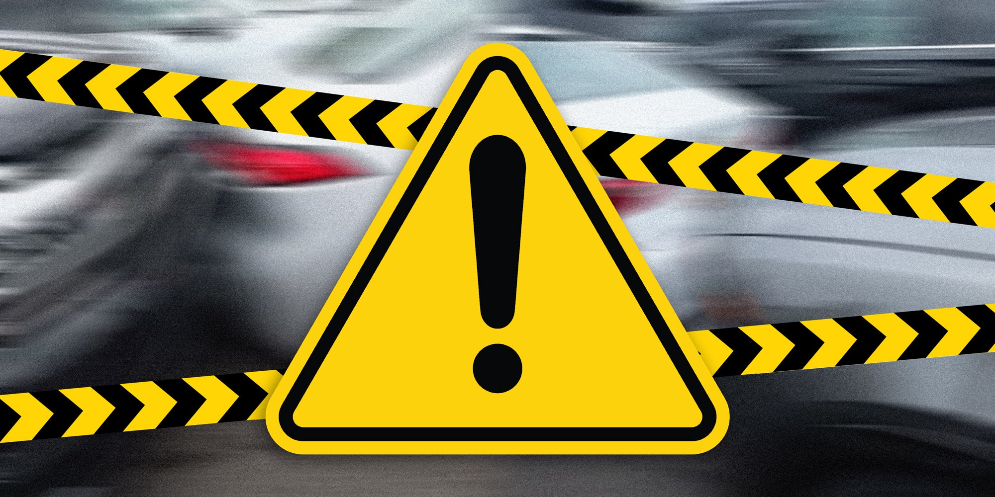 Warning sign and tape cover a blurred background.