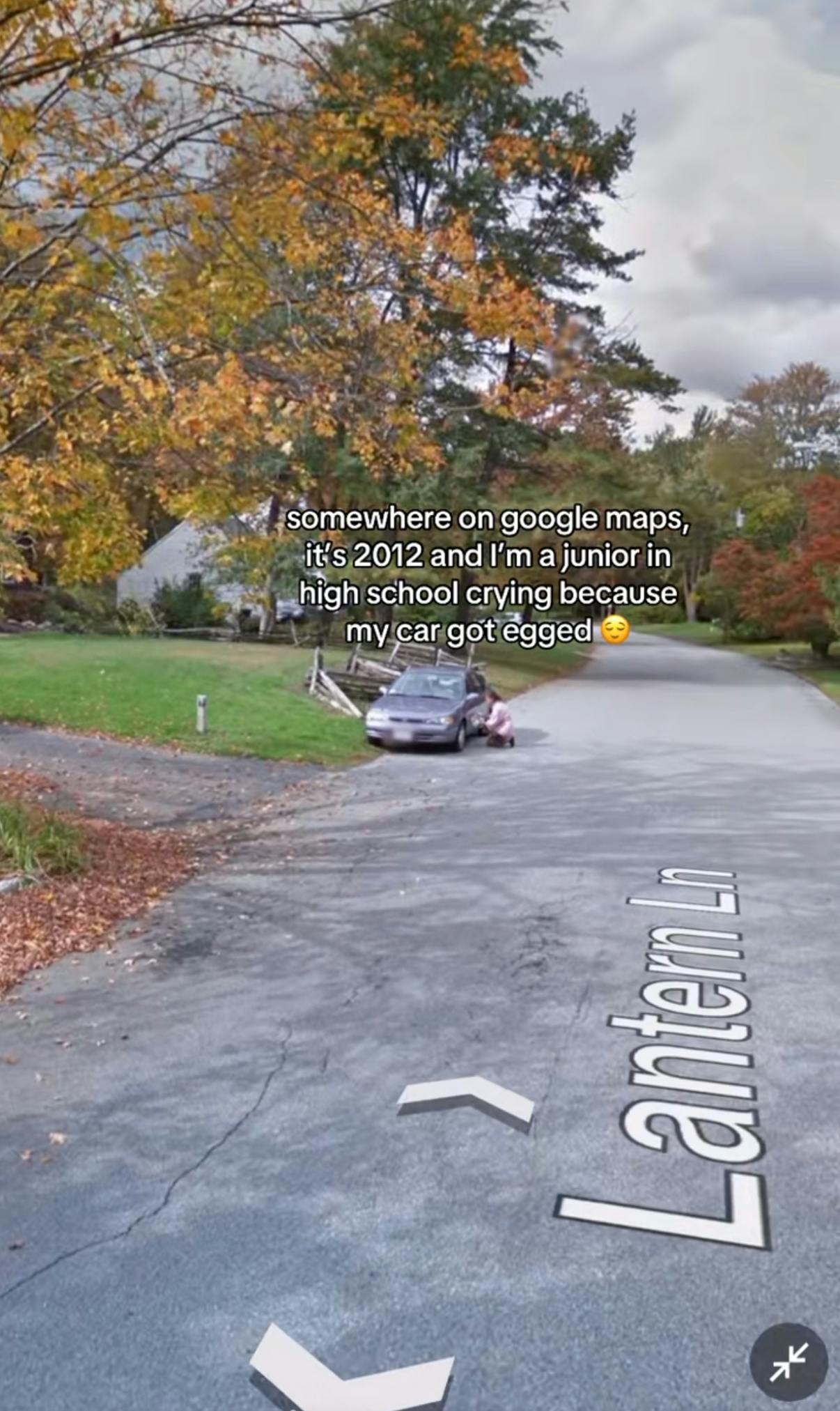 Somewhere on Google trend screenshot of a teenager kneeling next to her car. Text overlay reads, 'Somewhere on Google maps, it's 2012 and I'm a junio in high school crying because my car got egged (smiley face emoji)'